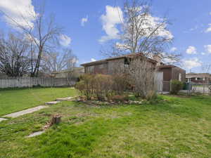 View of yard with fence