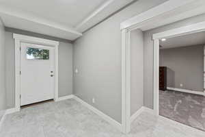 Foyer featuring baseboards