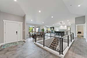 Entrance foyer with baseboards and recessed lighting