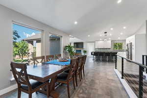 Dining space with baseboards and recessed lighting