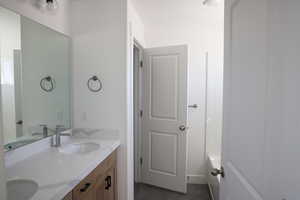 Full bath with double vanity and a sink