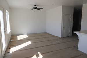 Empty room with baseboards and ceiling fan