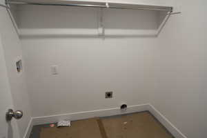 Laundry area with washer hookup, baseboards, laundry area, and hookup for an electric dryer