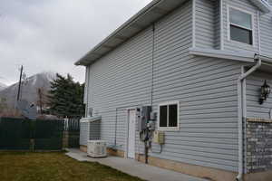 Side view of home. Backup generator.