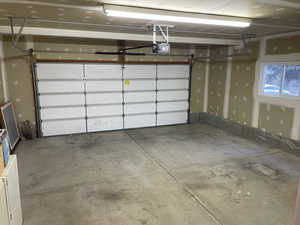Spacious garage with insulated door.