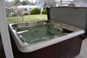 Hot tub/spa under covered patio.