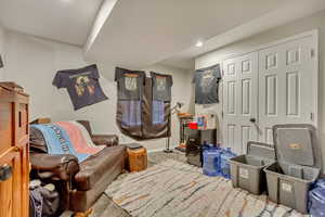 Sitting room featuring carpet, baseboards, and recessed lighting