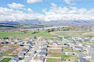 Drone / aerial view with a residential view and a water and mountain view