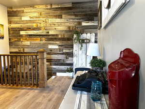 Interior space featuring wooden walls and wood finished floors