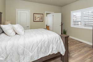 Master Bedroom featuring baseboards and wood finished floors