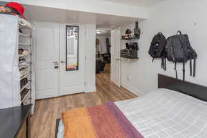 Bedroom with baseboards and wood finished floors