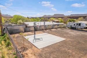 Exterior space with fence and a mountain view