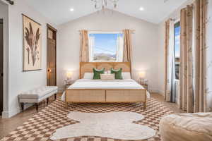 Bedroom with baseboards, lofted ceiling, and recessed lighting
