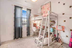 Bedroom with baseboards, carpet floors, and visible vents
