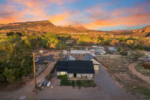 Aerial view at dusk featuring a mountain view