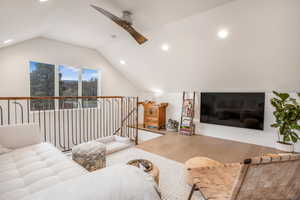 Living area featuring wood finished floors, vaulted ceiling, recessed lighting, and a ceiling fan