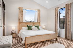 Bedroom featuring multiple windows, vaulted ceiling, and recessed lighting