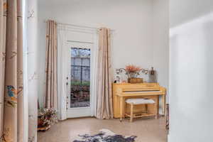 Foyer featuring speckled floor