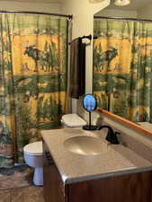 Bathroom featuring toilet and vanity