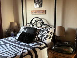 Bedroom with a textured wall