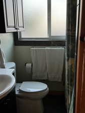 Full bath with toilet and vanity