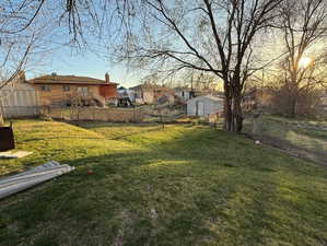 View of yard featuring fence