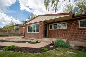 View of front of house featuring brick siding