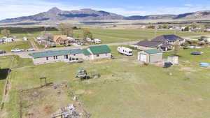 Drone / aerial view featuring a mountain view and a rural view