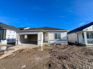 Back of property featuring an attached garage