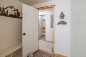 Hallway with dark carpet