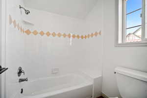 Full bathroom featuring toilet and shower / bathing tub combination