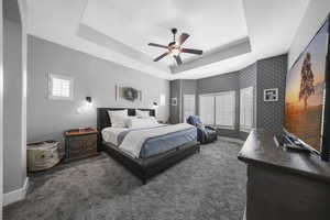 This main floor primary retreats offers a tray ceiling, bay window plus an attached spa style bath and walk-in closet.