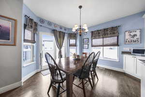 Your dining room offers hardwood floors and a sunny bay window with sliding doors to your gigantic deck.
