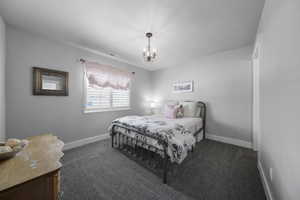 This room is like a second primary suite with an attached full bathroom plus plantation shutters, newer paint and newer carpeting.