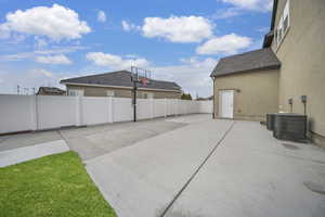 The sports court can also be used for RV parking in this fully fenced backyard.  The RV pad also offers electrical hookups for an RV.