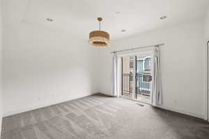 Empty room featuring recessed lighting, visible vents, baseboards, and carpet floors