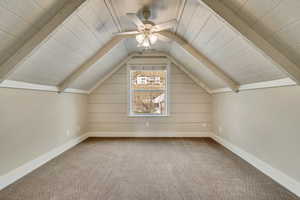 Bonus room featuring, a ceiling fan, carpet, and vaulted ceiling