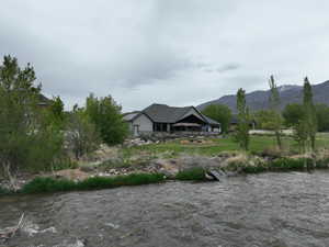 Property view of mountains with a water view