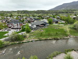 Drone / aerial view featuring a mountain view and a residential view