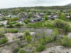 Bird's eye view with a water and mountain view and a residential view