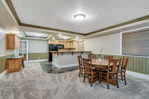 Basement kitchen/dining area is open to family room