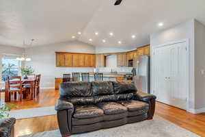 Main living room has open floor plan with vaulted ceiling