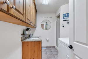 Main floor laundry has convenient half bath