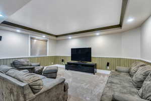 Basement family room has tray ceiling and is wired for surround sound