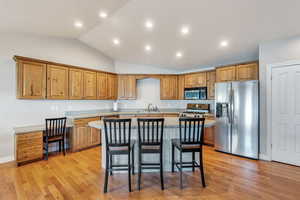 Kitchen has large island and barstool seating