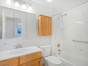 Full bath with toilet, shower / bath combination, and vanity