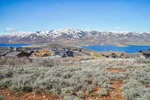 Property view of mountains featuring a water view