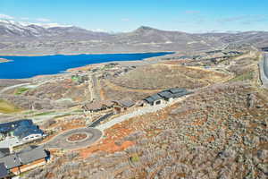 Aerial view featuring a water and mountain view