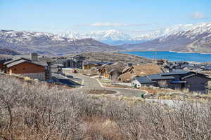 View of mountain feature with a residential view and a water view