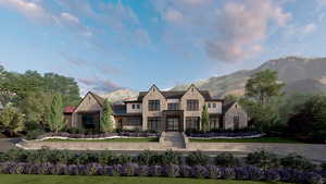 View of front of house featuring a mountain view, stone siding, metal roof, and a standing seam roof